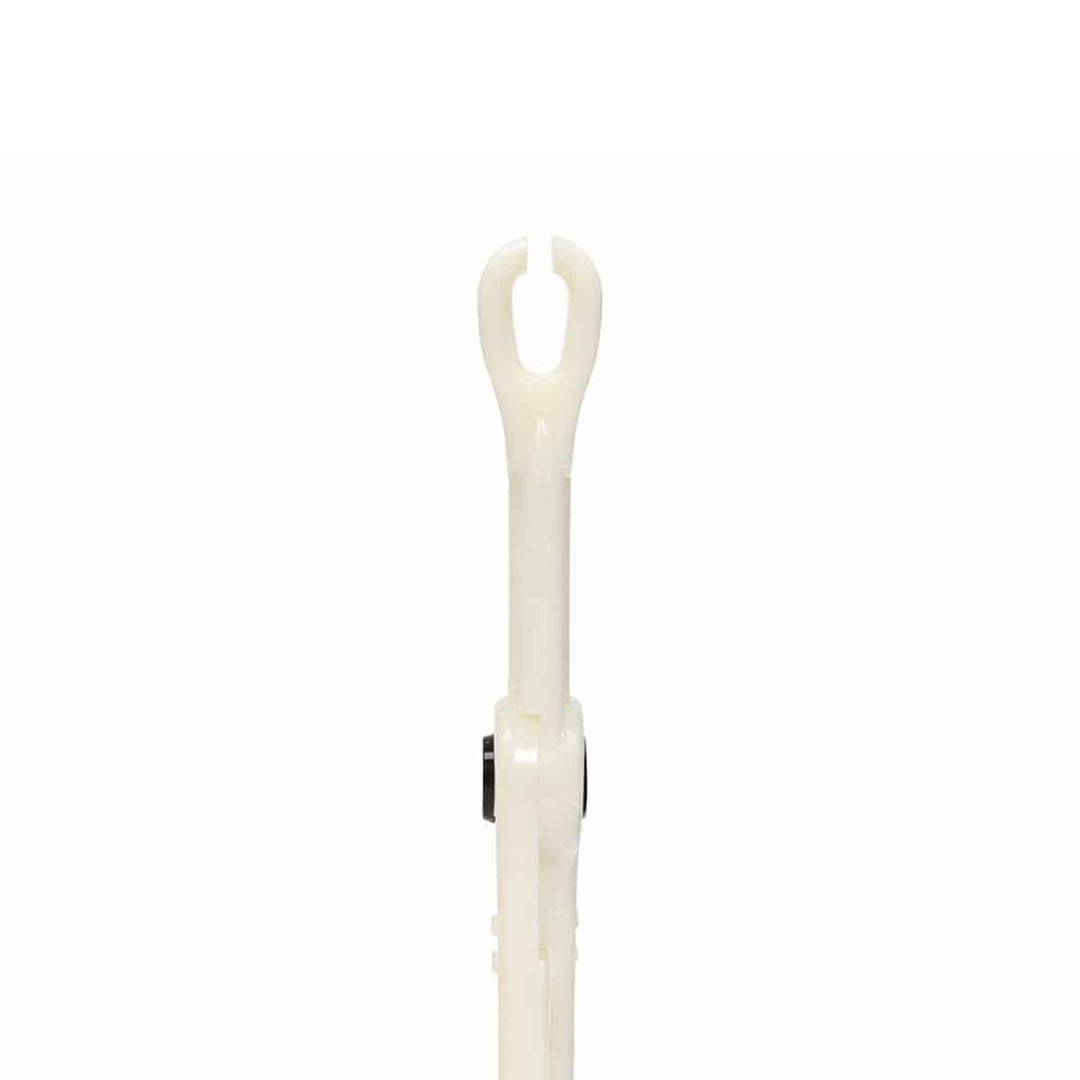 White plastic piercing tool with a curved head on a white background