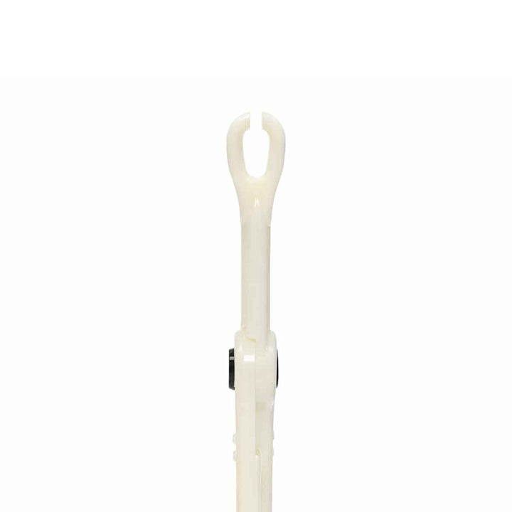 White plastic piercing tool with a curved head on a white background