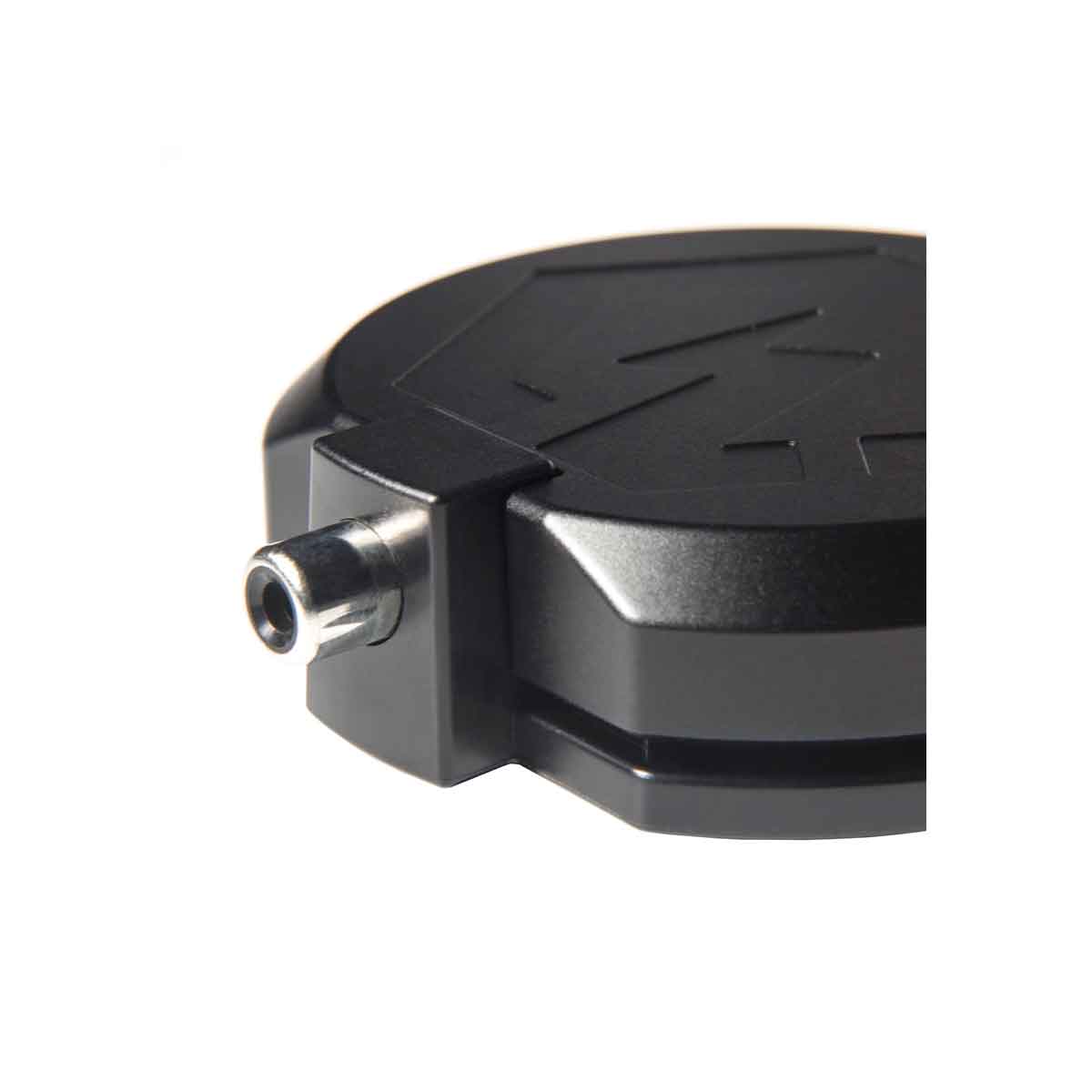 Black metal component with a cylindrical socket on a white background