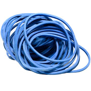A bulk pile of professional blue rubber bands for tattoo machine setups.