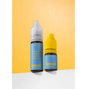 Two Brovi e-liquid bottles standing upright on a white surface against a yellow-orange gradient background. The bottle on the left is taller, has a clear cap, and a blue label with yellow text reading 'brovi' and 'e-liquid'; the bottle on the right is shorter, has a bright yellow cap, and a matching blue label.