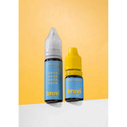 Two small Brovi essential oil bottles standing on a white surface against a yellow background. The taller bottle has a clear cap and a light blue label, while the shorter bottle has a bright yellow cap and a matching light blue label.