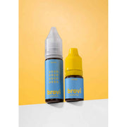 Two Brovi essential oil dropper bottles, one with a clear cap and one with a yellow cap, standing on a white surface against a yellow background.