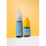 Two Brovi essential oil bottles standing on a white surface against a warm yellow background. One bottle has a light blue label and a white cap, and the other has a light blue label and a yellow cap.