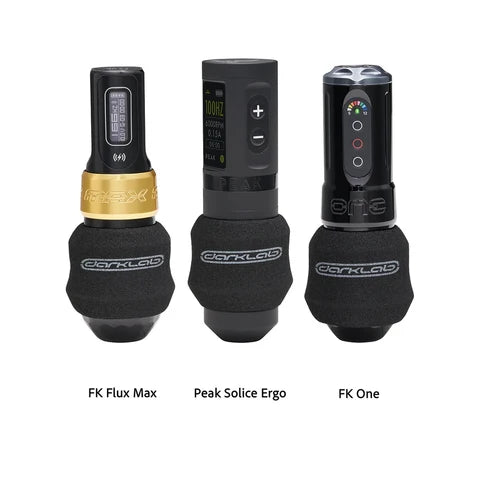 Three tattoo machines with darklab disposable foam grips, labeled FK Flux Max, Peak Solice Ergo, and FK One.