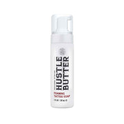 Foaming tattoo soap bottle labeled 'Hustle Butter' on a white background
