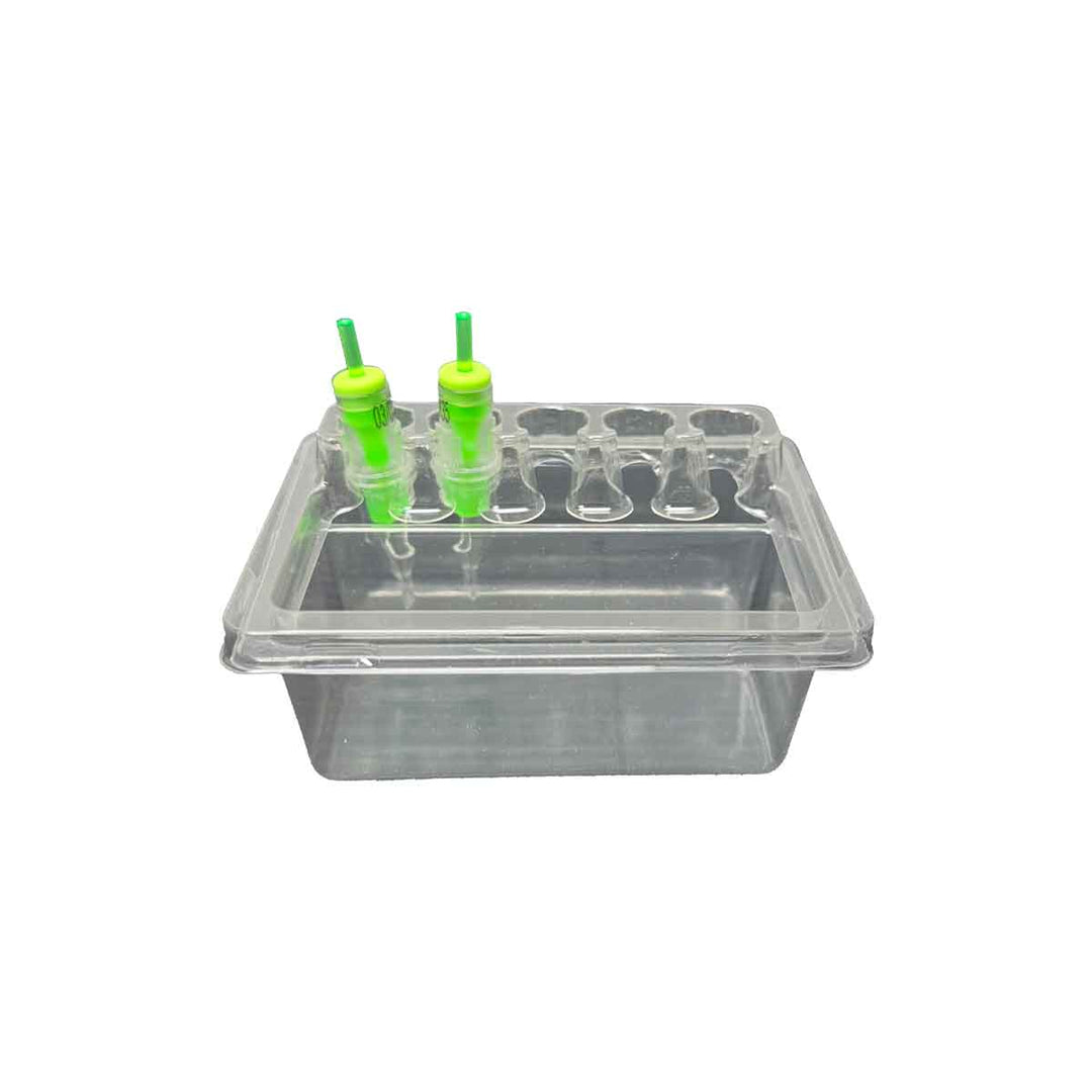 Clear plastic tattoo cartridge holder tray with green cartridges on a white background